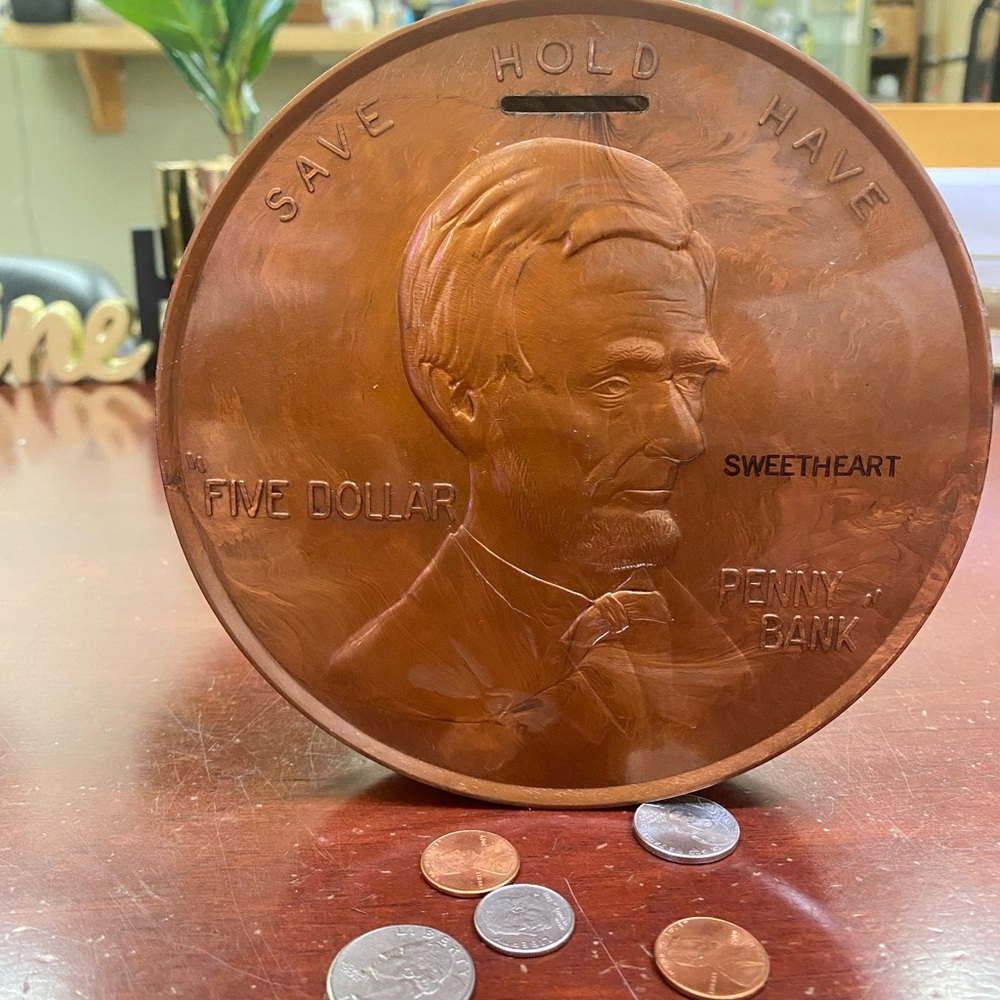 Vintage 1960 five dollar penny shaped bank